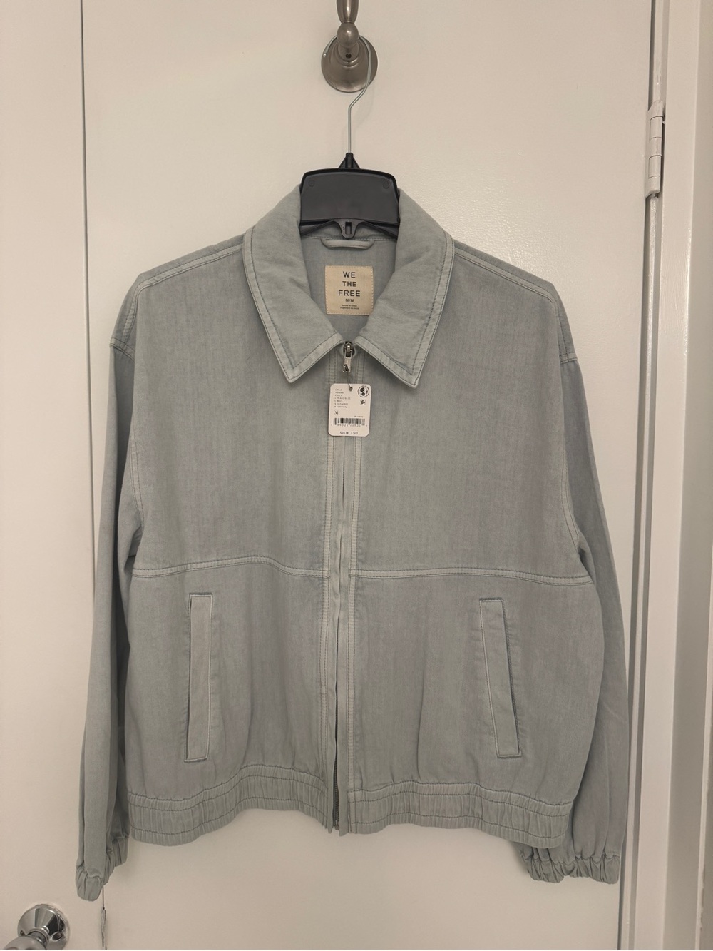 New with tags!
We The Free Light Blue Zip-Front women's denim jacket